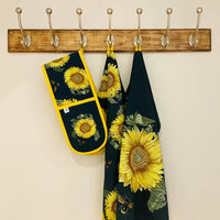 Double oven gloves made from sustainable cotton, featuring a sunflower and bee design inspired by the RHS Lindley Collections.