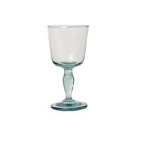 A clear recycled glass wine glass with a fluted shape and a thick stem.